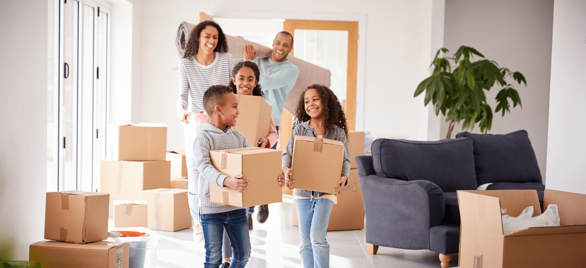 Happy family moving in to their new home thanks to Proven Mortgage Solutions
