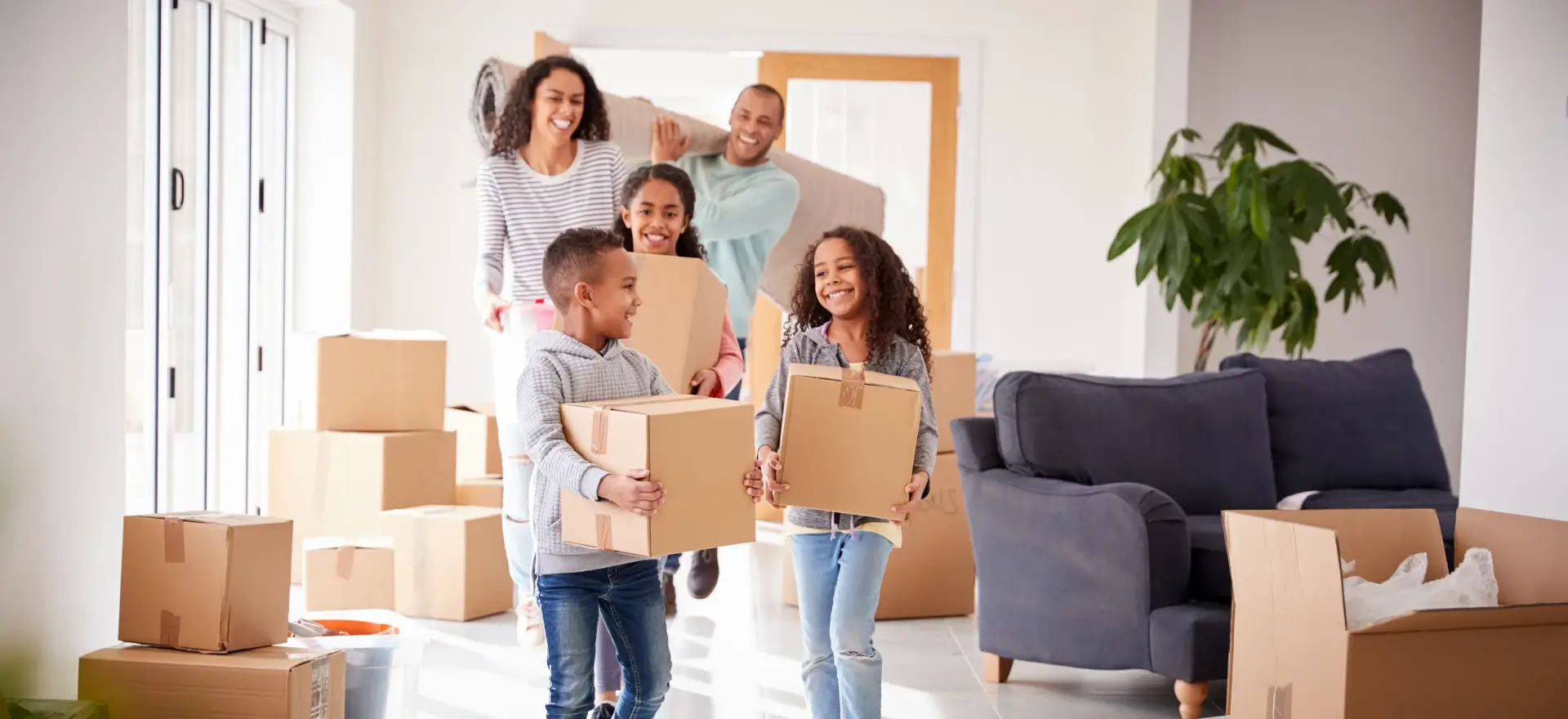 Happy family moving in to their new home thanks to Proven Mortgage Solutions